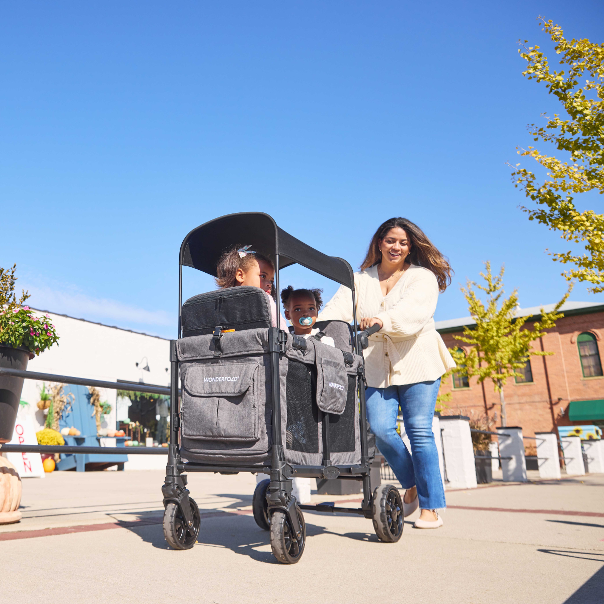 mom and kids in a Charcoal Gray Elite Pro Stroller